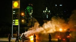 Firefighters Extinguishing Flames at a Gas Station